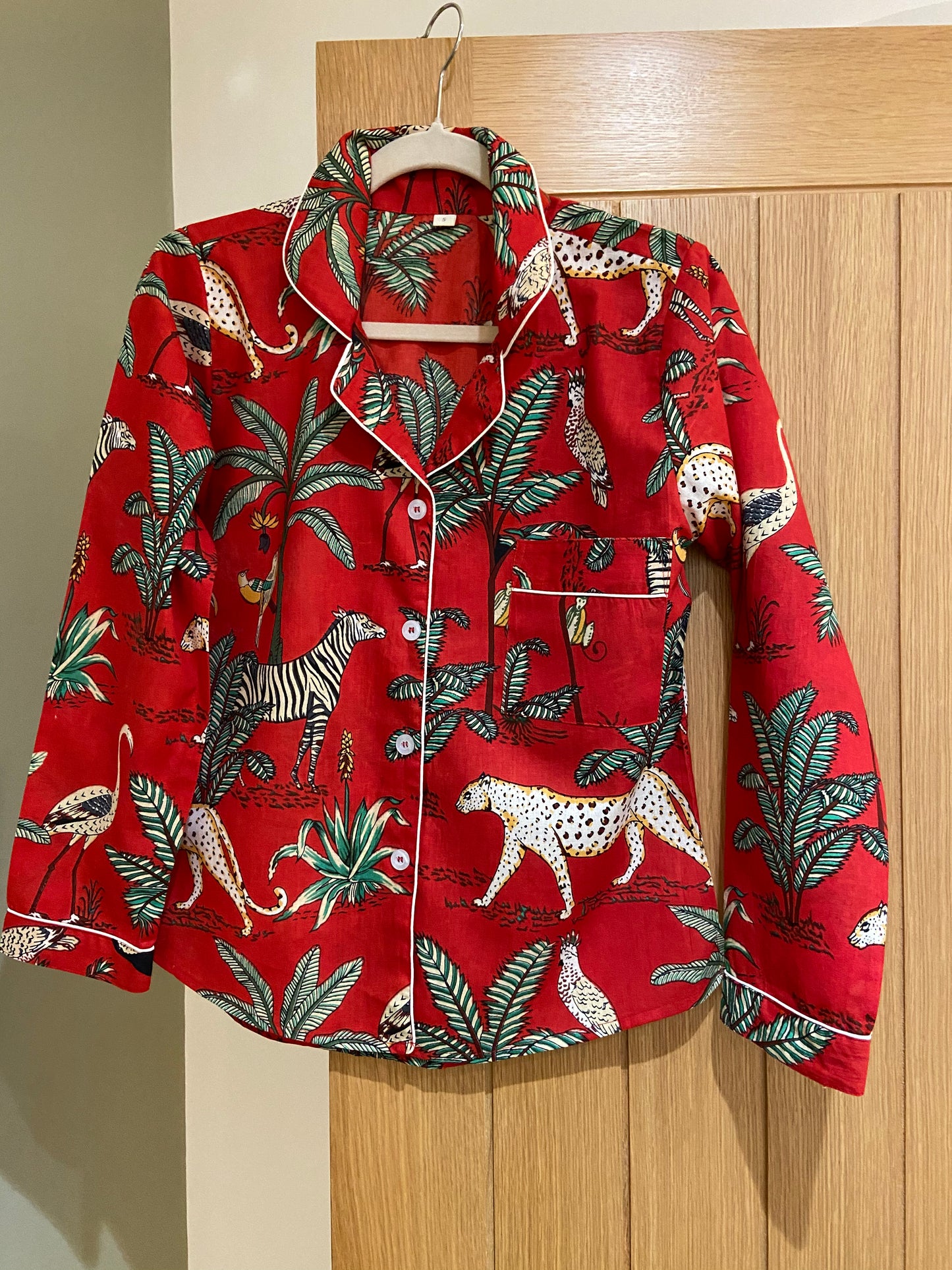red pyjamas, Safari Cotton pyjamas for women. Bright Crimson cotton printed with a fabulous safari theme. Zebra, Monkeys, leopards and parrots. colourful pyjamas, pyjama set for women, patterned pyjamas for women, ladies pyjama, womens nightwear, womens sleepwear, cotton pyjamas, colourful pyjamas for women, colourful womens sleepwear, cotton pyjama set, 100% cotton, cotton pjs, womens PJs