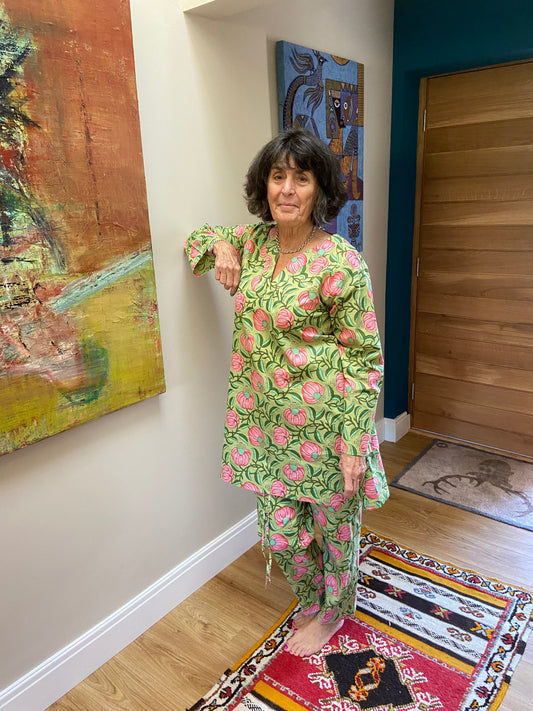 Peaceful and relaxing rose pattern pyjamas with green leaf background. Long length pyjama top with no buttons for style and comfort. Pyjamas for women to sleep or lounge in.  Available in 3 sizes - Medium, Large and Extra Lagre. Beautifully soft 100% Cotton Long Length Top Comes with cute matching bag.
