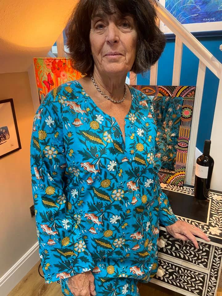 The most gorgeous bright refreshing blue pyjamas for women with botanical design or leaves and flowers in white, yellow and peach. Long length pyjama top with long sleeves and no buttons for style and comfort. Pyjamas for women to sleep or lounge in luxury. Available in 3 sizes - Medium, Large and Extra Lagre. Beautifully soft 100% Cotton Long Length Top Comes with cute matching bag.