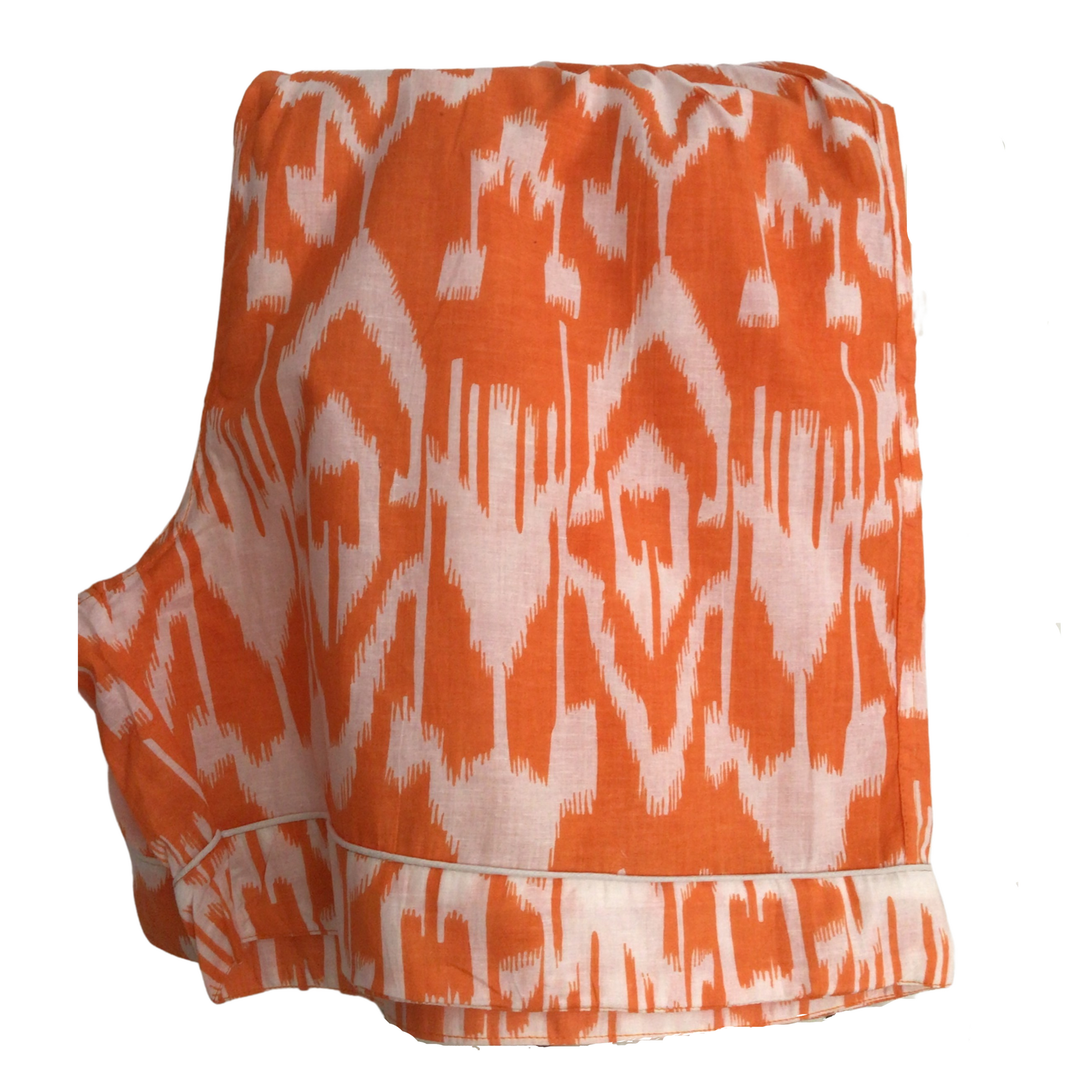 Luxury lounging with 100% fine cotton pjs. Tangerine and white Ikat. Ladies pyjamas. Classic pyjama styling. Short sleeves and shorts with Elasticated waist. Presented in a beautiful cloth gift bag; nightwear made from hand-printed cotton. sleepwear for women, ladies pyjamas in orange, cotton short pjs, summer pyjamas
