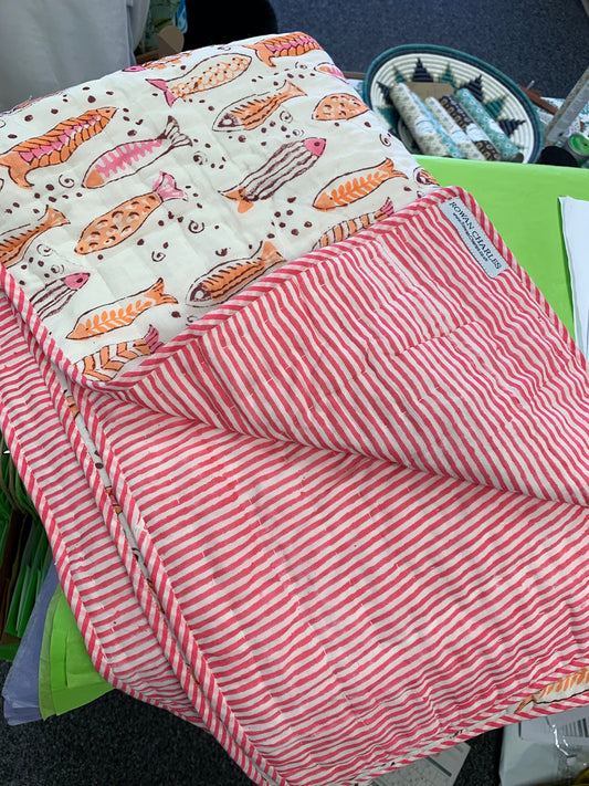 100% cotton pink / orange fish baby quilt white background with pink / orange fish . Baby quilt, quilt for babies. 100% hand block printed cotton baby quilts for bed time, play time, on the beach or for a picnic Colour: pink / orange fish pattern with pink / orange striped reverse, Baby Play mat, Play mats for baby